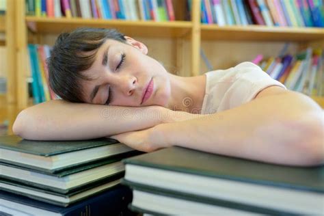 Student Sleeping On Books In Library Stock Photo Image Of Sleep