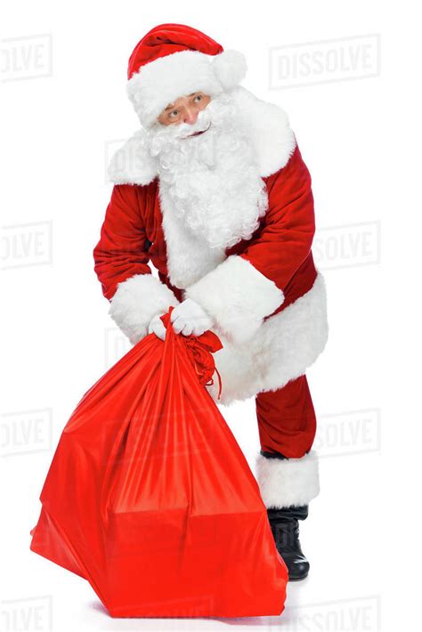 Santa Claus Holding Red Christmas Bag Isolated On White Stock Photo