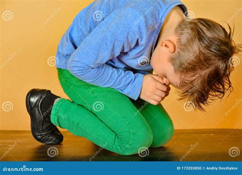 The Boy Bowed In Prayer Before God The Child Is Kneeling In The Prayer