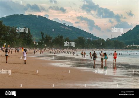 People walking on the Phuket beach Stock Photo - Alamy