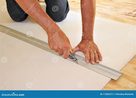 Man Cutting Drywall With Utility Knife Stock Photography Image