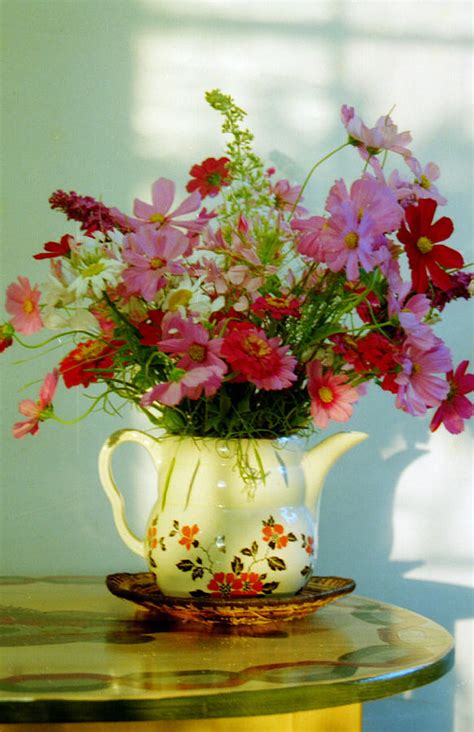 Teapots With Flowers In Them