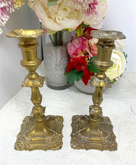 Pair Of Antique Ornate Brass Candlesticks Square Bases And Candle Cups With Columnar Shafts