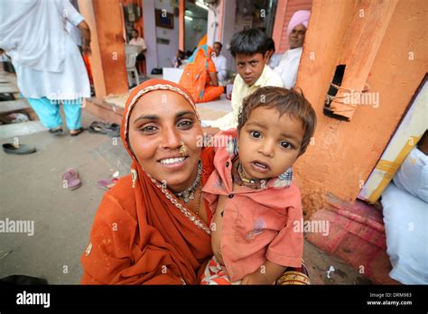 Poor Indian Mother With Baby