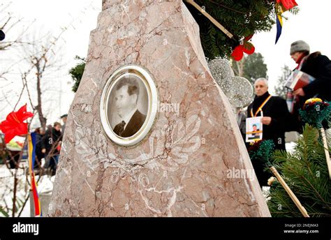 Romanians Stand Around The Grave Of Late Communist Dictator Nicolae