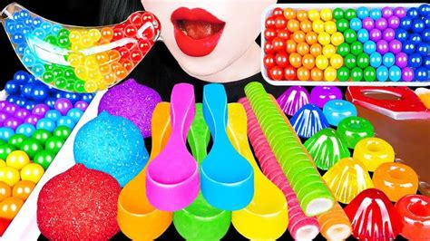 An Assortment Of Colorful Beads And Plastic Utensils On Display With A