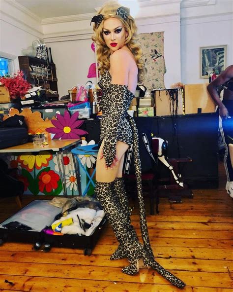 A Mannequin Dressed In Leopard Print Poses For The Camera At An Art Studio