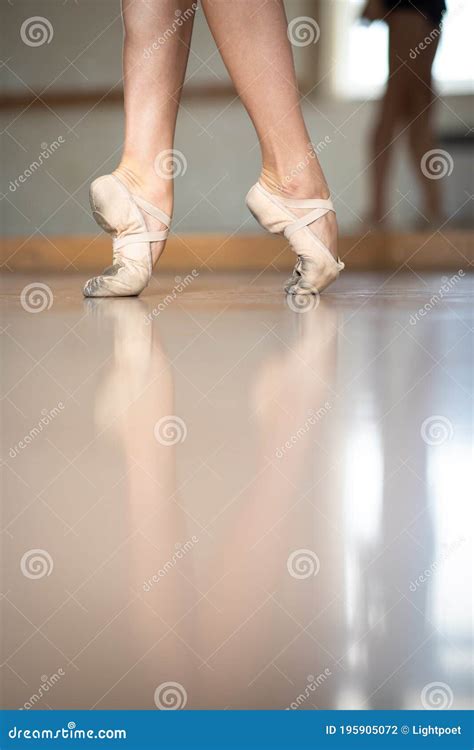 Classical Ballet Dancer In Pointe Shoes Moving Perfectly Gracefully With Purple Fabric Stock