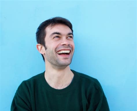 Premium Photo Close Up Portrait Of A Cheerful Young Man Smiling