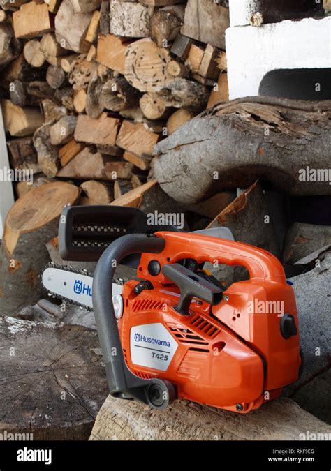 Brand New Husqvarna T Chain Saw On Woodpile Ready Fro Use Stock