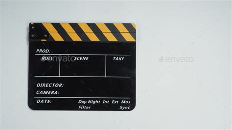 ฉlapper board in yellow and black color on white background. Stock Photo by puibunny