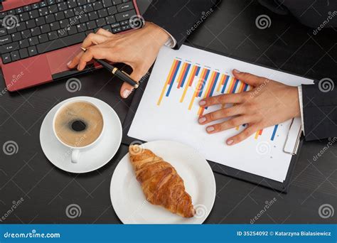 Businessman Work Using The Computer Calculating Invoice In Office