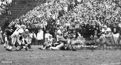 Willie Galimore of the Chicago Bears carries the ball against Bill ...