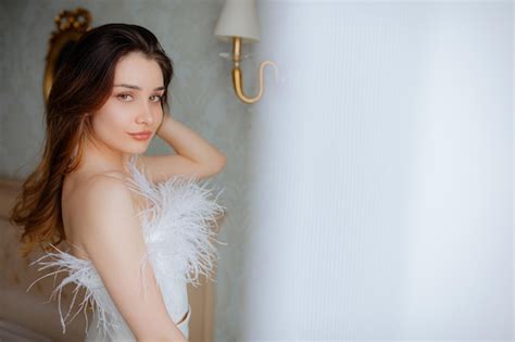 Premium Photo Charming Brunette Woman Standing In Wedding Dress