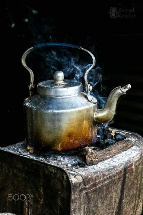 A Tea Kettle With Steam Coming Out Of It