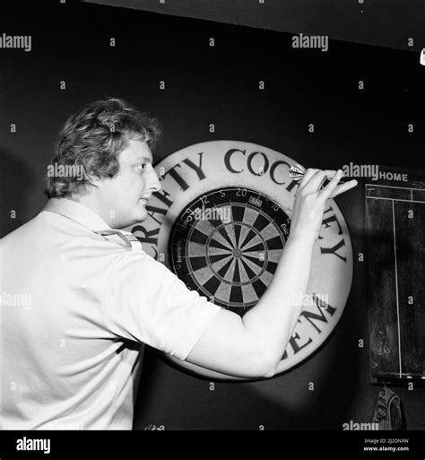 Close Up Feature On British Darts Player Eric Bristow In Dart Throwing