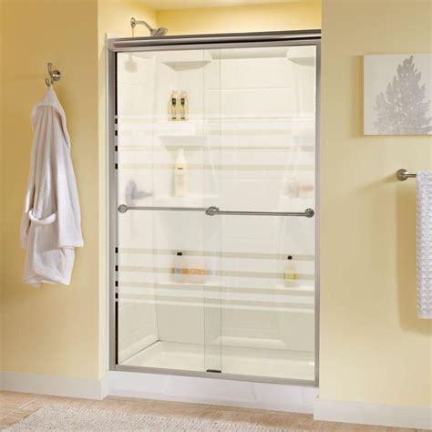 A Bathroom With Yellow Walls And White Towels Hanging On The Shower