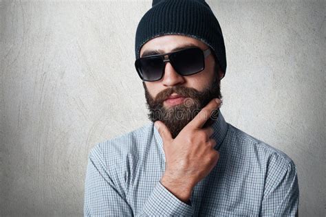 Close Up Portrait Of Handsome Bearded Man Wearing Stylish Black Cap