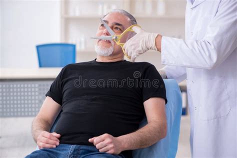 Old Man Visiting Young Doctor for Plastic Surgery Stock Photo - Image ...