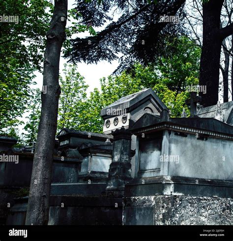 Tombstones In Cemetery At Dusk Gothic Style Crosses Paris Stock Photo