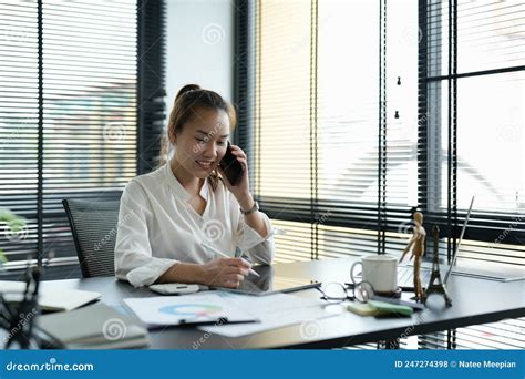 Portrait Asian Business Woman Making A Phone Call And Smiling While