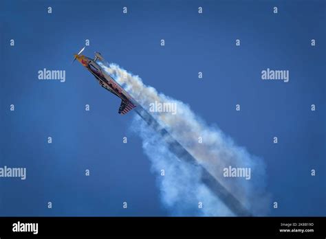 A Stunt Pilot With The Red Bull Air Force Flies In To The Sun With