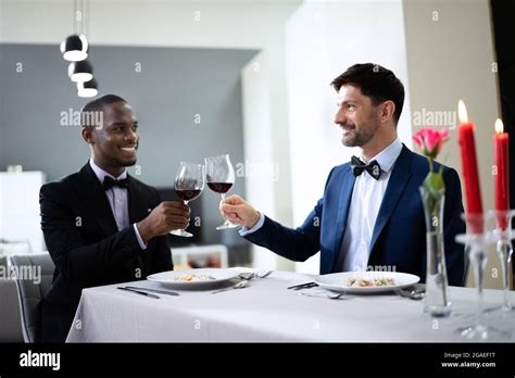 Gay Couple Having Dinner In Restaurant People In Love Stock Photo Alamy