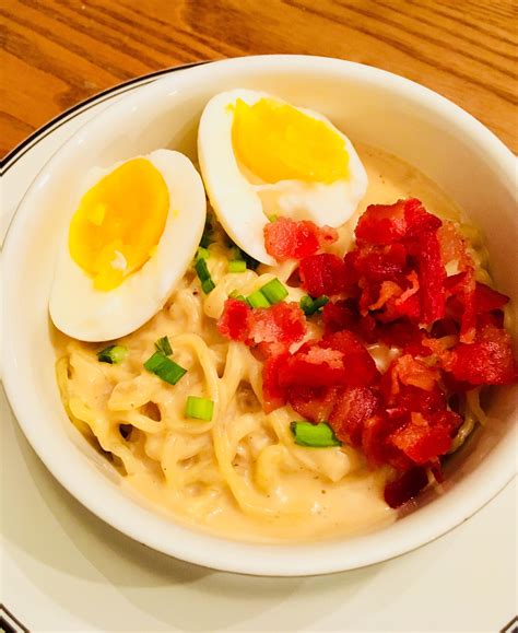 Homemade Ramen Bacon And Soft Boiled Egg In Mornay Sauce Garnished With Scallions And