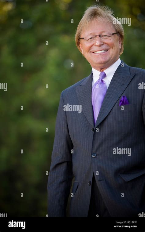 50 Year Old Business Man Standing Outside Wearing A Suit And Tie