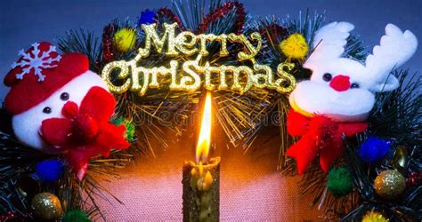 Candle Near Christmas Wreath with Christmas Symbols of Snowman and Deer_ Stock Photo - Image of ...