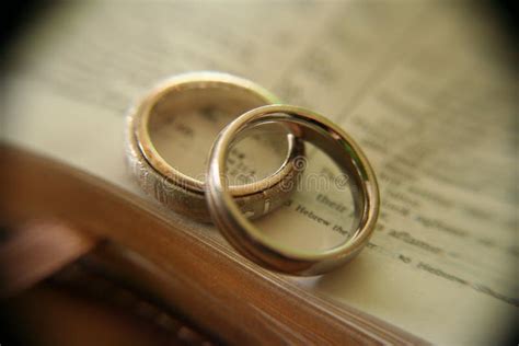 White Gold Wedding Rings On Bible Stock Images - Image: 1386564