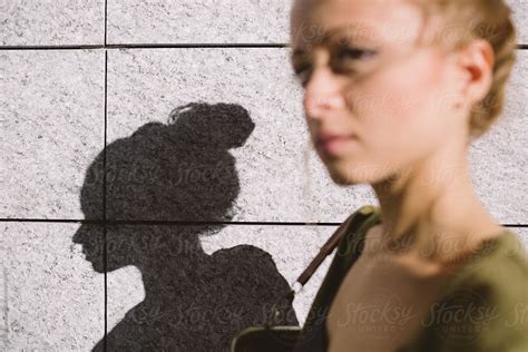 Woman Walking With Shadow By Stocksy Contributor Michela Ravasio