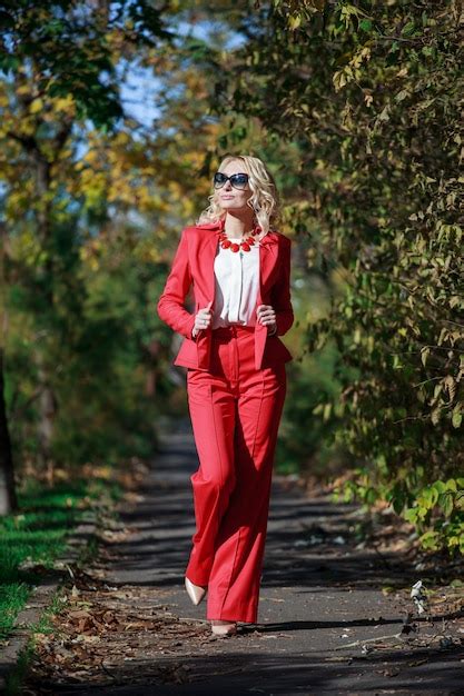 Premium Photo Beautiful Girl In A Red Suit In Autumn