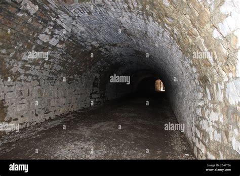 ancient dark secret passage of a castle in Italy Stock Photo - Alamy