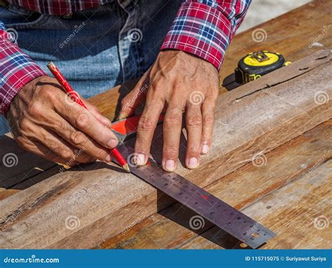 Carpenter With Ruler Measuring Wood Profession Carpentry Wood Stock