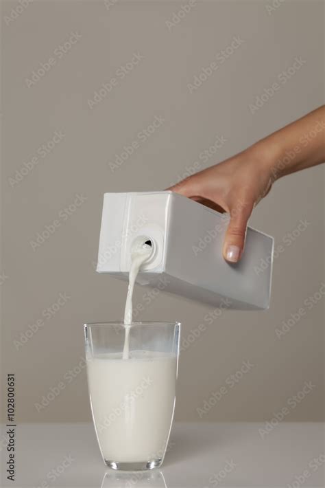 Pouring Milk From The Carton Into A Glass Stock Foto Adobe Stock