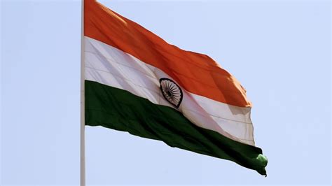 India flag flying high with pride in blue sky, India flag fluttering ...