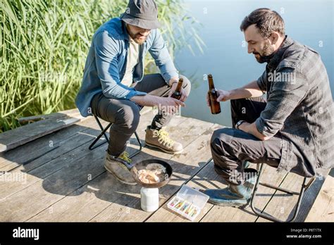 Man Sitting In Chair Fishing High Resolution Stock Photography And