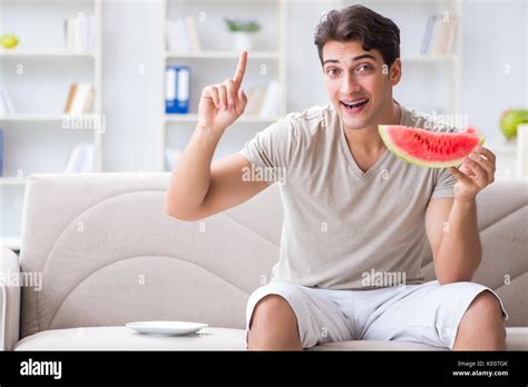 Man Eating Watermelon At Home Stock Photo Alamy