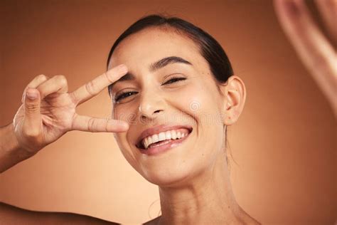 Portrait Of Comic Happy Girl Holding Orange Near Face Stock Image