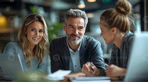 Friendly travel consultant explaining travel packages to an interested