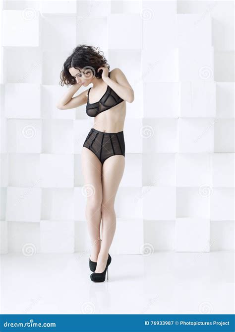 Woman Wearing Transparent Black Lingerie Posing In Studio Stock Image