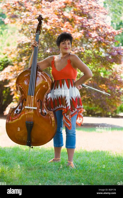 Portrait Of A Mature Woman Holding A Violin And Smiling Stock Photo Alamy