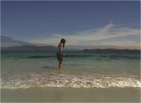 North Beach 2 Girl Paddling In The Sea On Iona Scotland Rob Outram