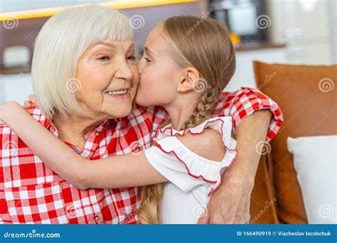 Loving Young Lady Kissing Her Happy Grandmother Stock Image Image Of