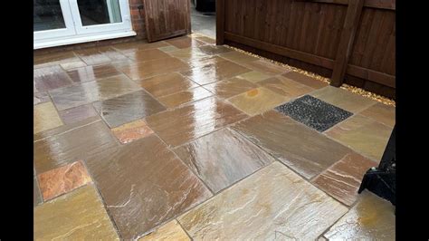 Buff Indian Sandstone Slabbed Patio With Charcoal Edging In Chester