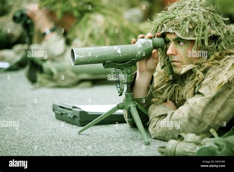 A Sniper Practices Observation Techniques Through A Spotting Scope