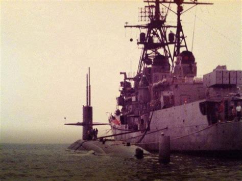 Sturgeon-class nuclear-powered attack submarine USS Whale (SSN-638) at anchor with Forrest ...