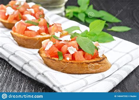 Bruschetta With Tomato And Feta On Board Stock Photo Image Of