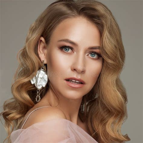 Portrait Of Luxury Blonde Woman With Perfect Makeup Posing Holding Pink